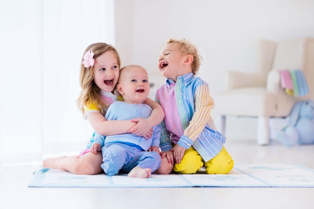 Three kids laughing