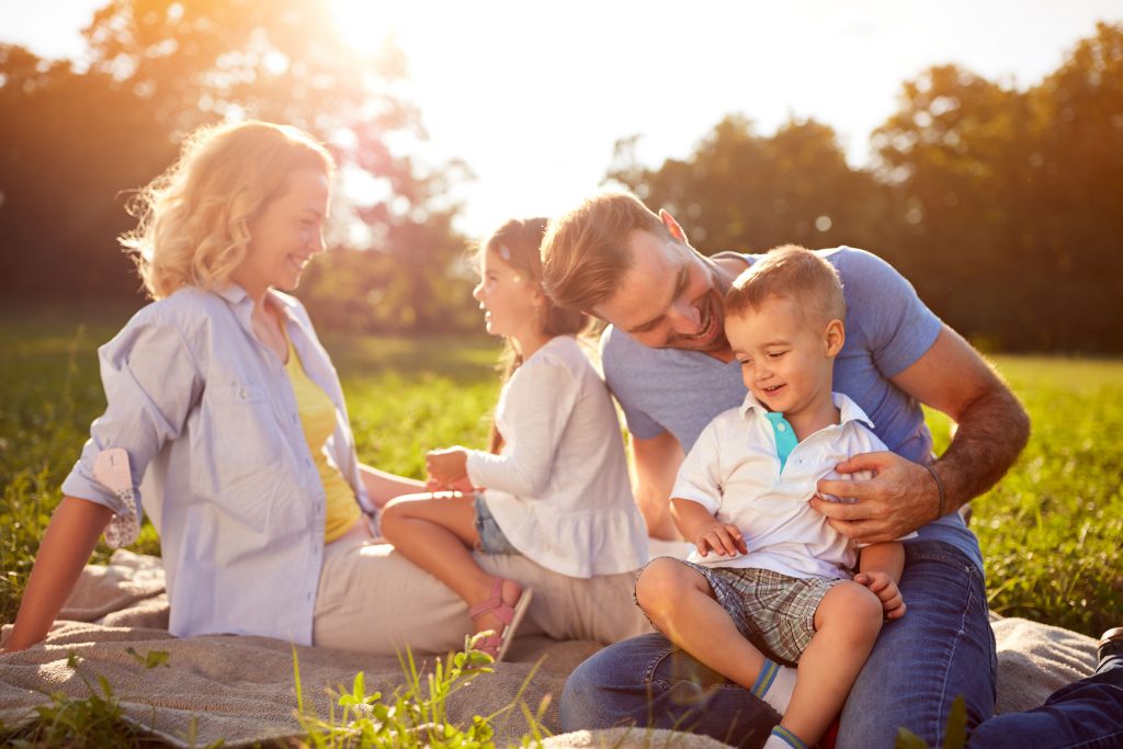 A family in a picnic mat